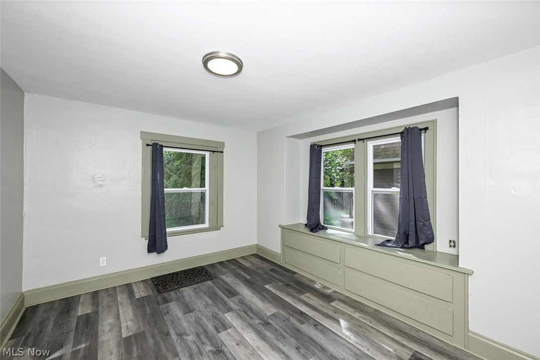 1313 Manchester Road Akron, OH 44307 - Photo 11 of 28 Built-in window seat with storage, multiple windows, wood-finish flooring, and flush-mount ceiling lighting
