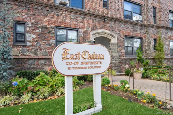 a sign on the brick wall