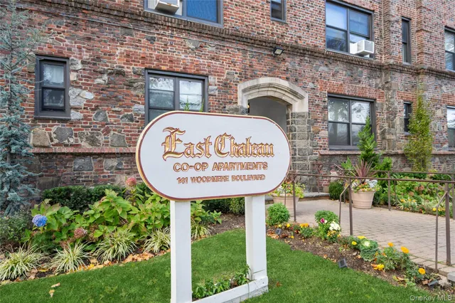 a sign on the brick wall