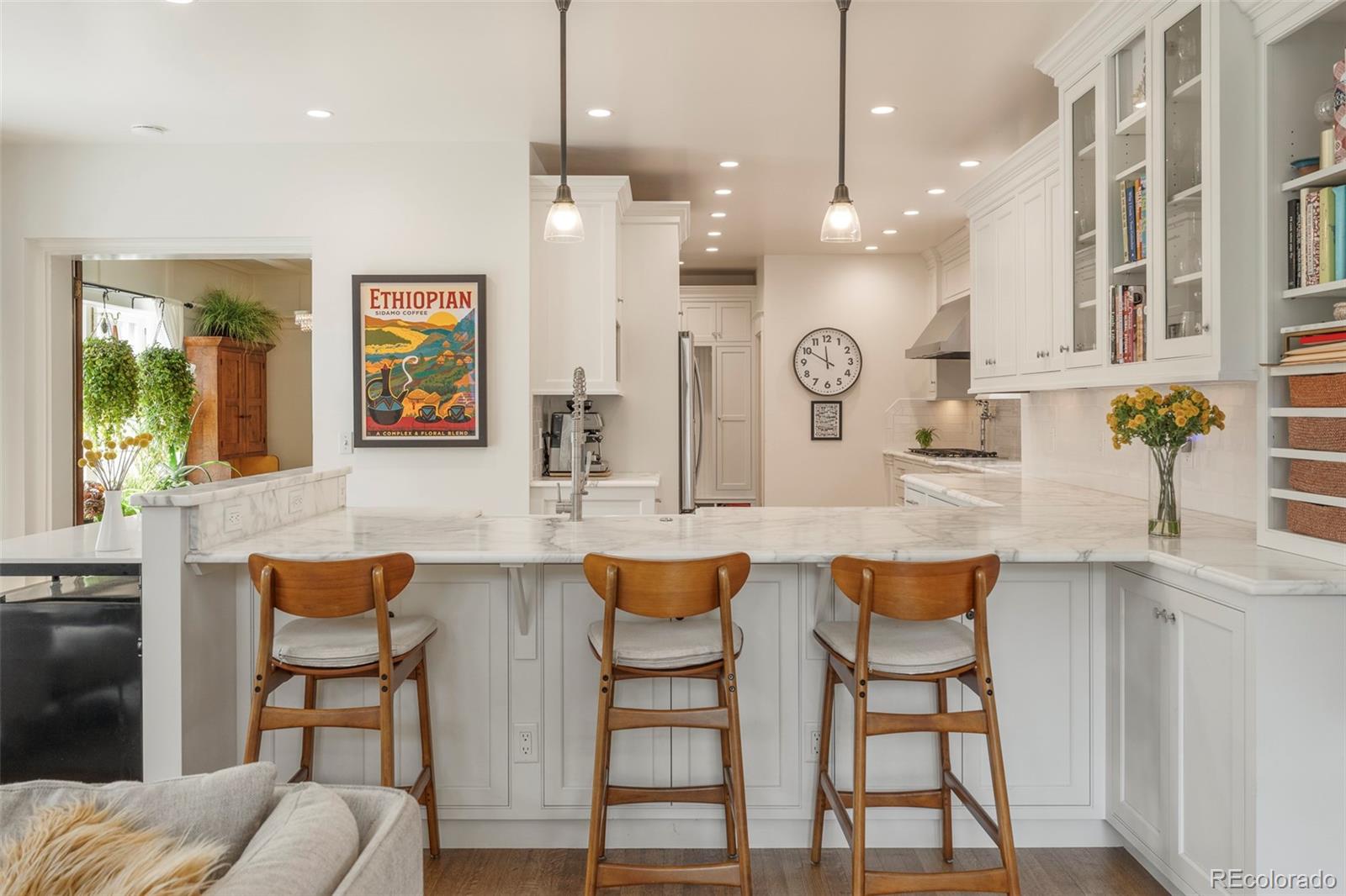 720 Franklin Street Denver, CO 80218 - Photo 11 of 39 a large kitchen with a table and chairs