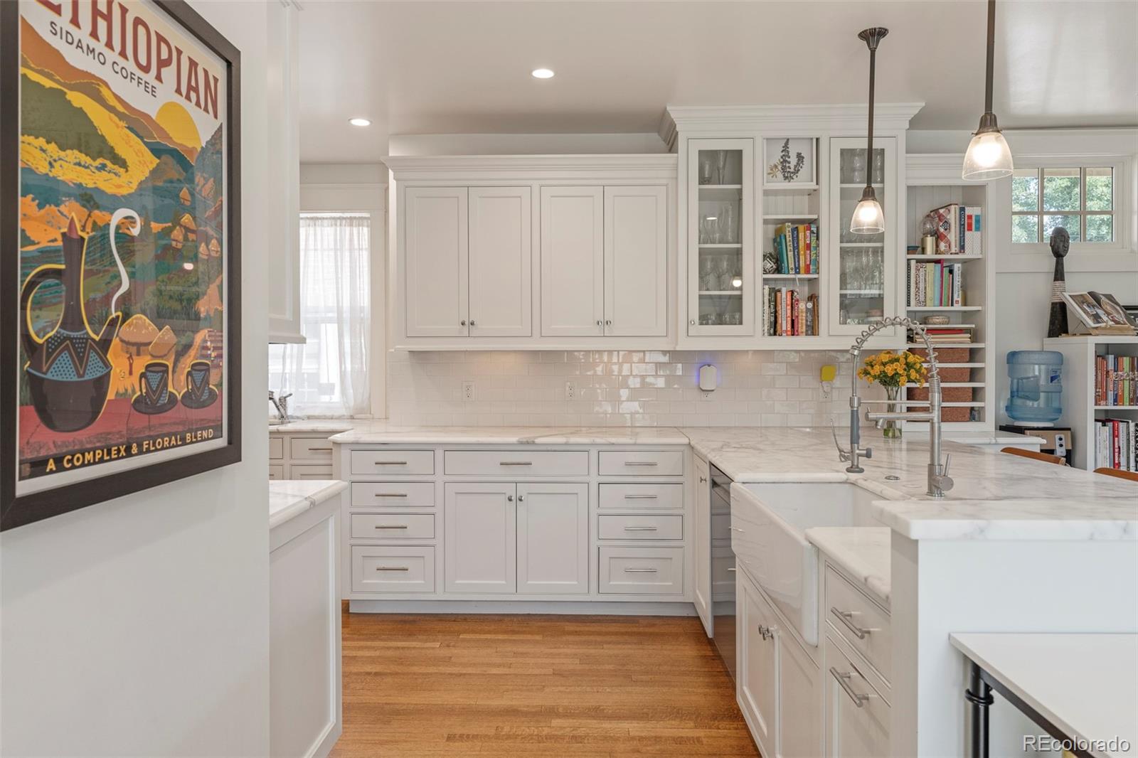 720 Franklin Street Denver, CO 80218 - Photo 12 of 39 a kitchen with stainless steel appliances granite countertop a sink and dishwasher a stove with wooden floor