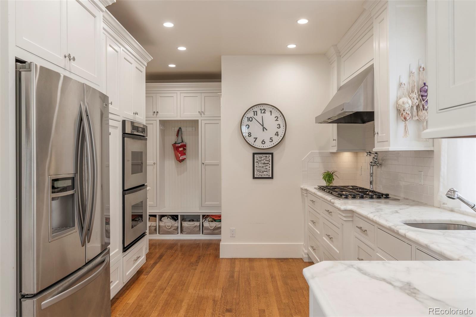 720 Franklin Street Denver, CO 80218 - Photo 13 of 39 a kitchen with a refrigerator and a stove
