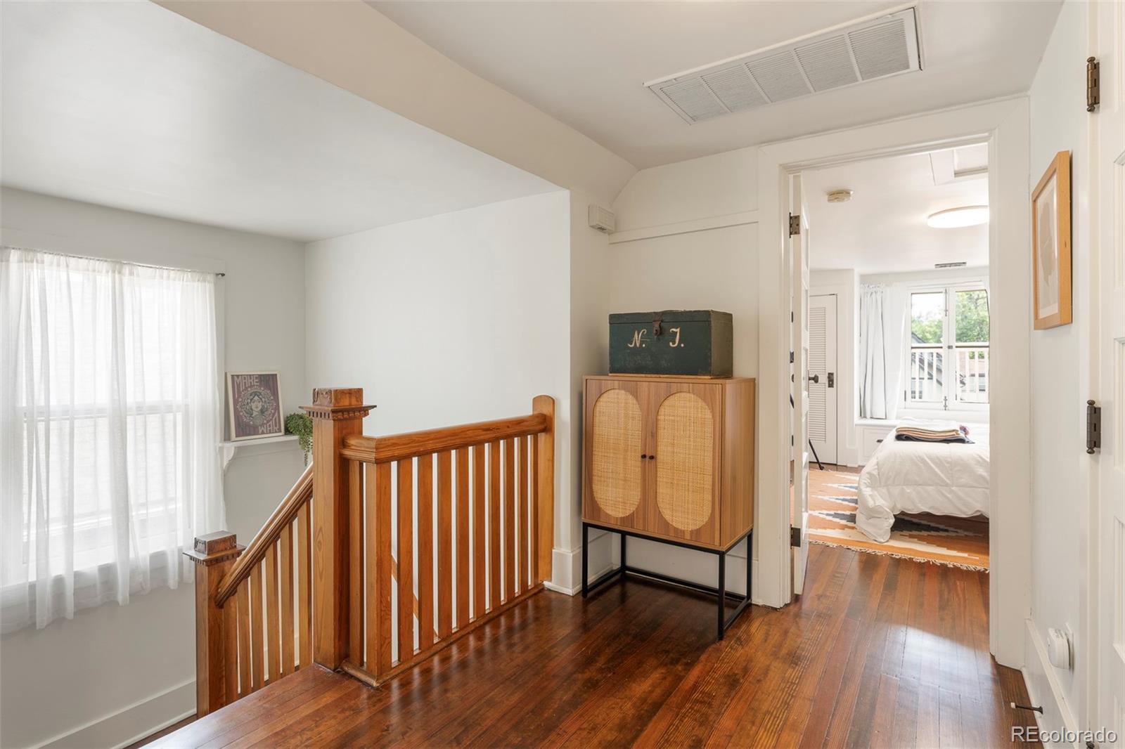 720 Franklin Street Denver, CO 80218 - Photo 16 of 39 a view of a hallway with wooden floor and windows
