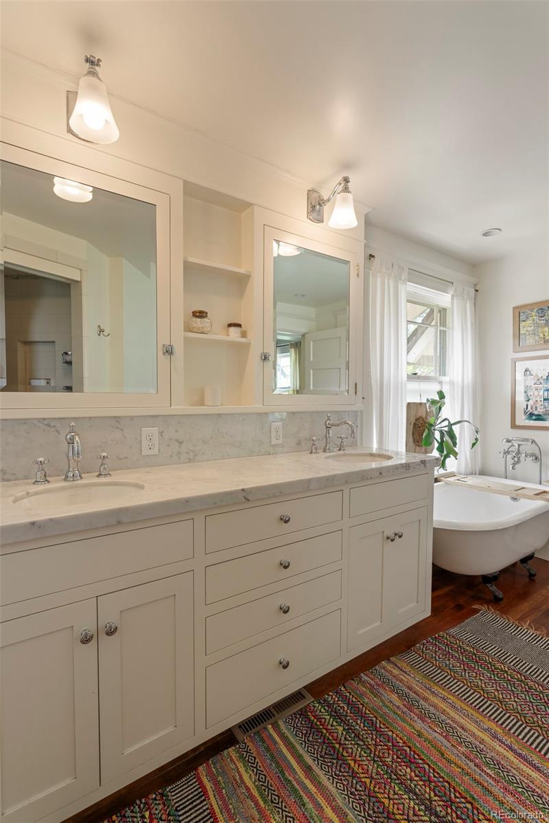 720 Franklin Street Denver, CO 80218 - Photo 18 of 39 a spacious bathroom with a double vanity sink and a mirror