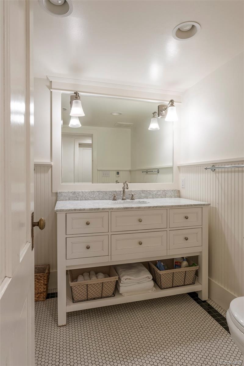 720 Franklin Street Denver, CO 80218 - Photo 25 of 39 a bathroom with a double vanity sink and a mirror