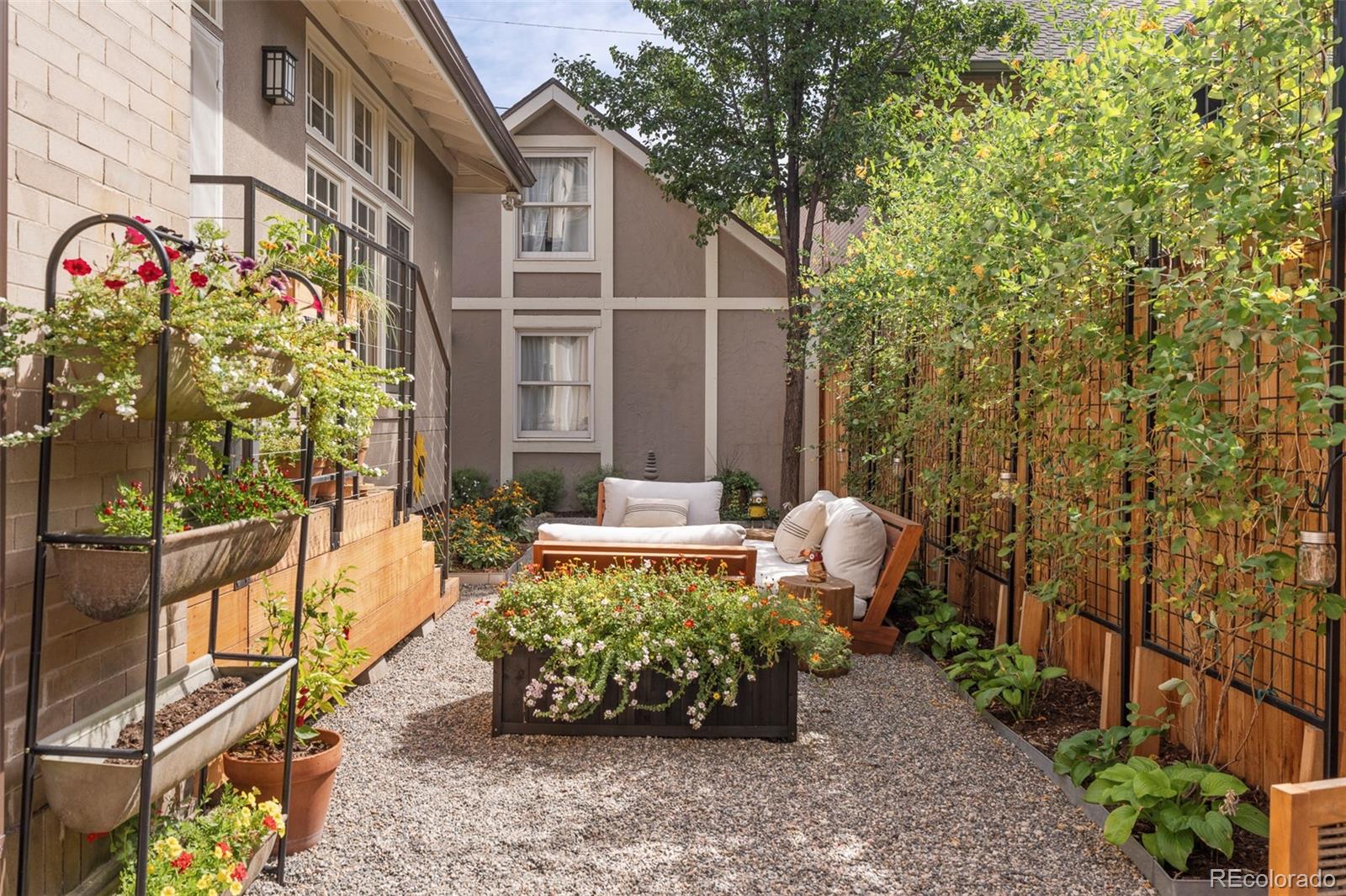 720 Franklin Street Denver, CO 80218 - Photo 28 of 39 a view of a patio with couches and table and chairs and potted plants
