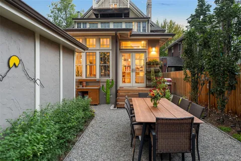 a view of a chairs and table in the patio