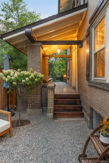 a view of a patio with table and chairs and potted plants
