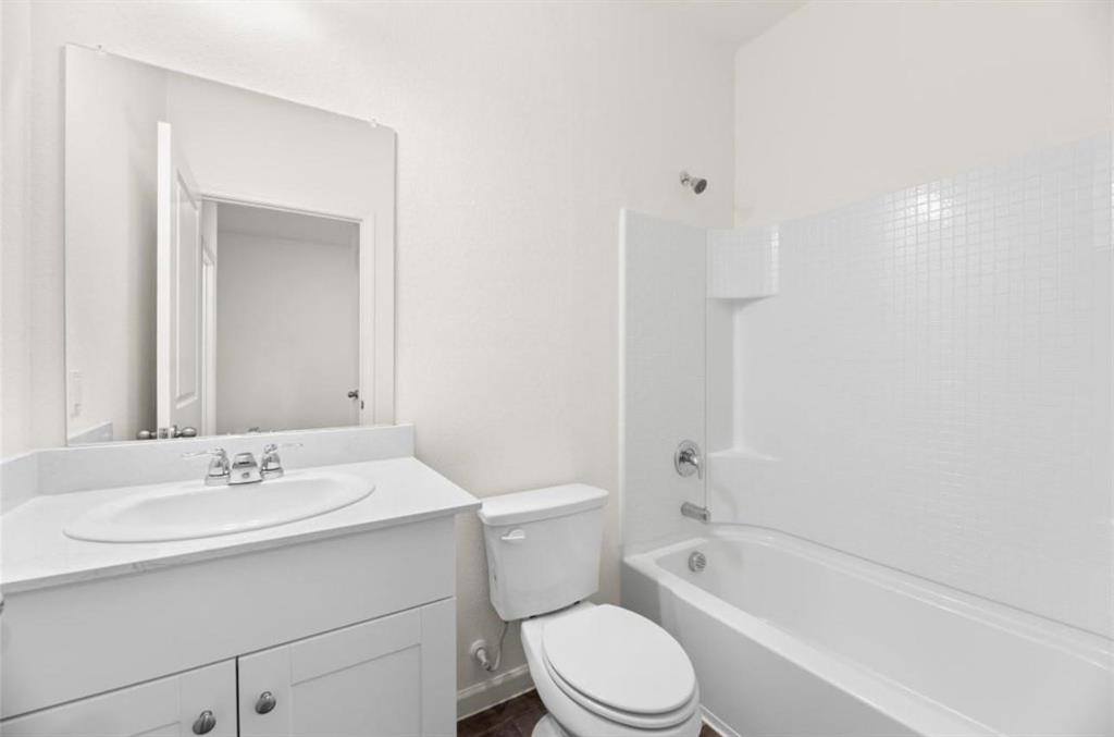10308 Holy Cross Lane Crowley, TX 76036 - Photo 7 of 27 a bathroom with a sink a toilet and shower