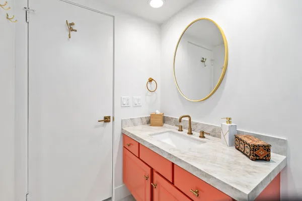 a bathroom with a sink and a mirror