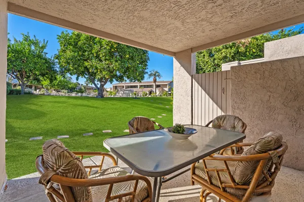 a view of an outdoor sitting area with furniture