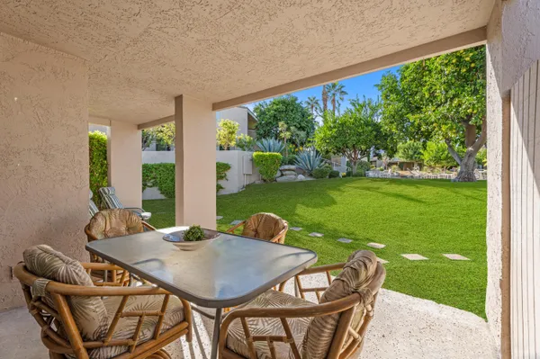 a outdoor dining space with furniture and garden