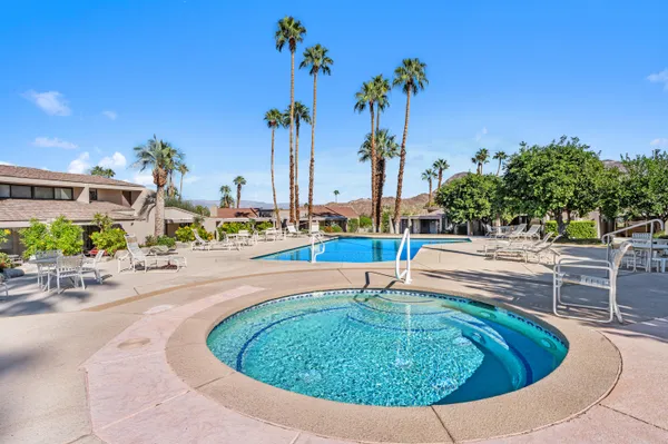 a view of a swimming pool with a patio