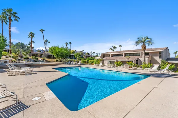 a view of a swimming pool and an outdoor space