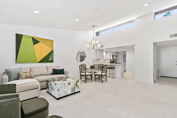 a living room with furniture and a table