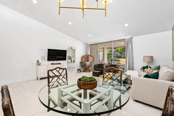 a living room with fireplace furniture and a flat screen tv