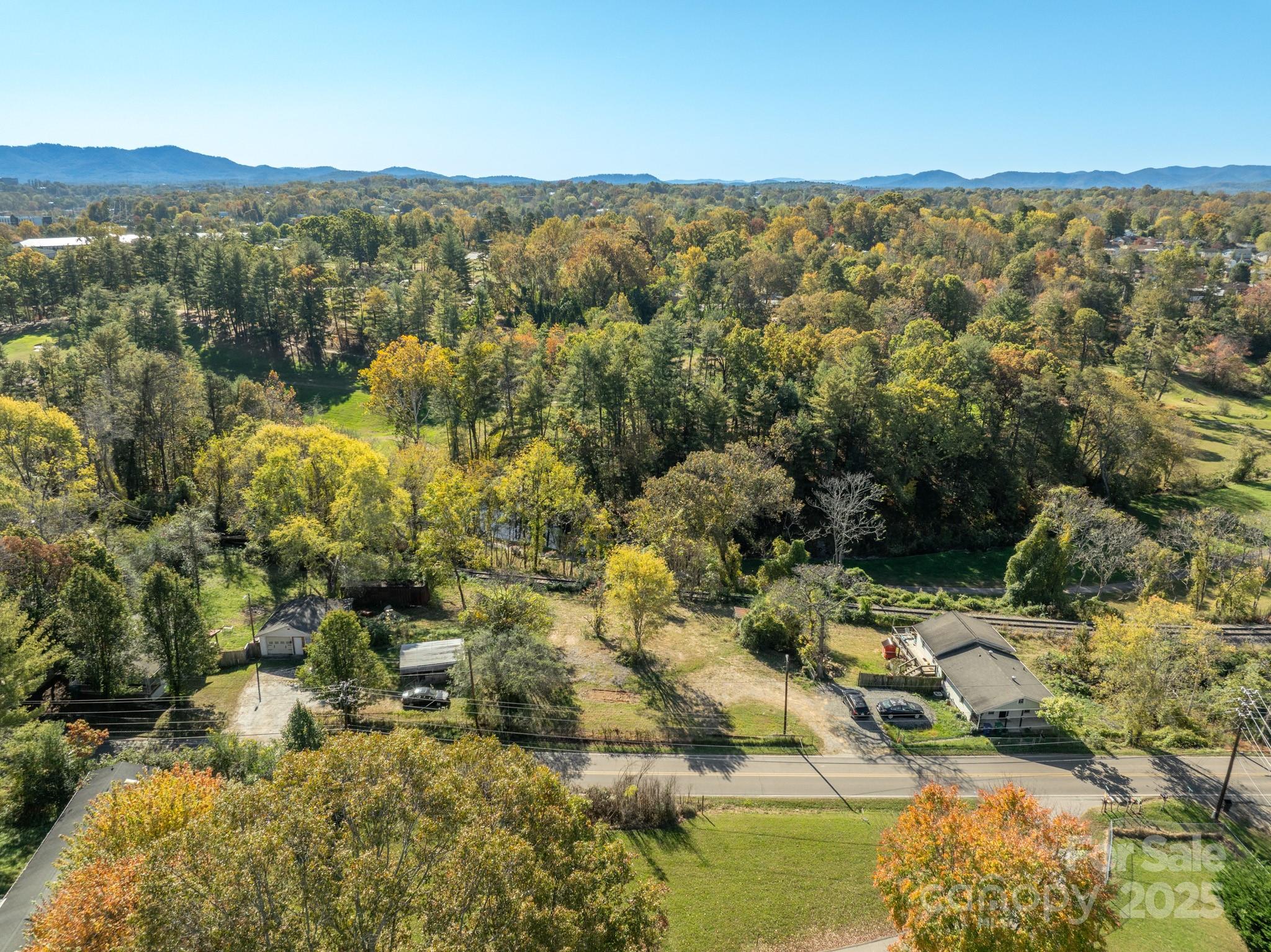 99999 Emma Road, Unit 3 Asheville, NC 28806 - Photo 2 of 10 a view of a city with mountains in the background