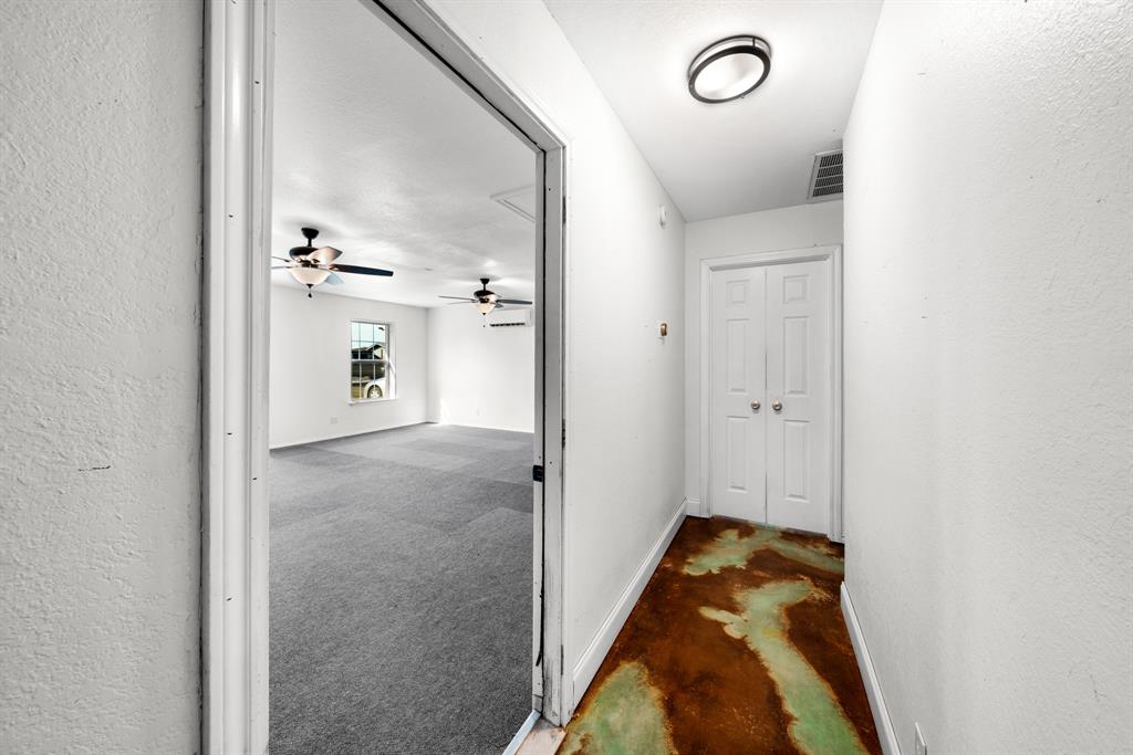 903 Amy Way Bonham, TX 75418 - Photo 15 of 27 Corridor featuring a textured wall and concrete flooring