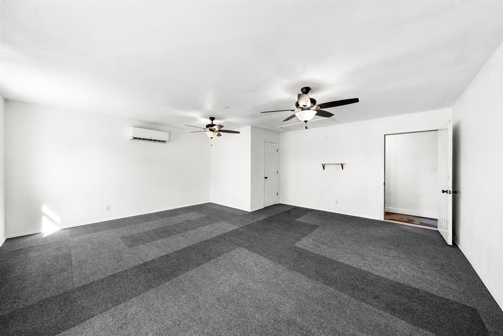 903 Amy Way Bonham, TX 75418 - Photo 16 of 27 Converted garage with dark colored carpet and a ceiling fan