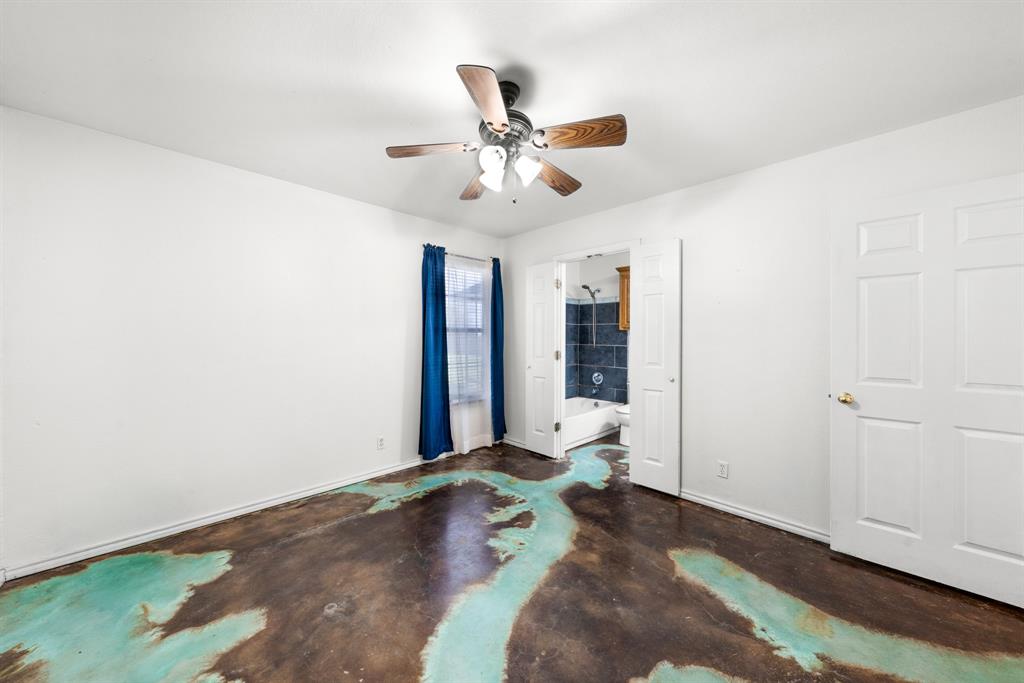 903 Amy Way Bonham, TX 75418 - Photo 18 of 27 Unfurnished bedroom with concrete floors, ensuite bath, and ceiling fan