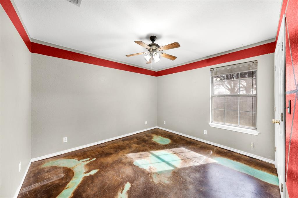 903 Amy Way Bonham, TX 75418 - Photo 22 of 27 Unfurnished room featuring a ceiling fan and concrete floors