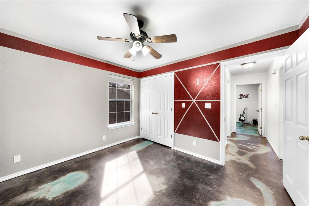 903 Amy Way Bonham, TX 75418 - Photo 23 of 27 Unfurnished bedroom with finished concrete flooring, ceiling fan, and a closet
