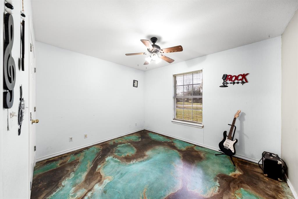 903 Amy Way Bonham, TX 75418 - Photo 24 of 27 Unfurnished room featuring concrete floors and ceiling fan