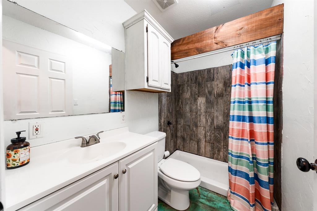 903 Amy Way Bonham, TX 75418 - Photo 26 of 27 Full bathroom with vanity and a shower stall