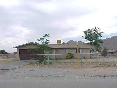 16030 Wichita Road Apple Valley, CA 92307 - Photo 1 of 1 a view of a house with a yard and a large tree
