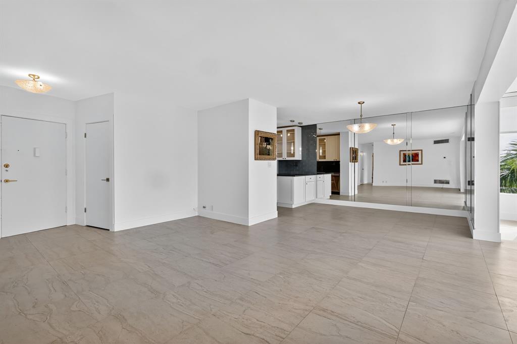 44 Cocoanut Row, Unit 507A Palm Beach, FL 33480 - Photo 13 of 60 a view of a kitchen with a refrigerator and a sink