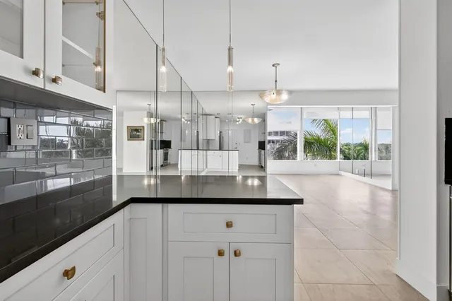 a kitchen with a sink and large window