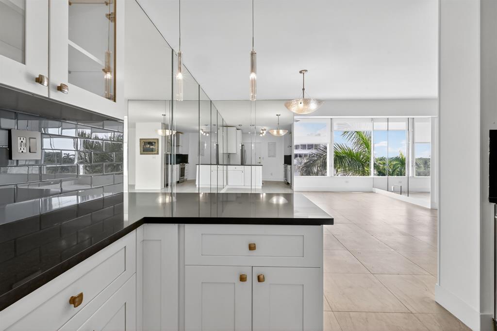 44 Cocoanut Row, Unit 507A Palm Beach, FL 33480 - Photo 14 of 60 a kitchen with a sink and large window