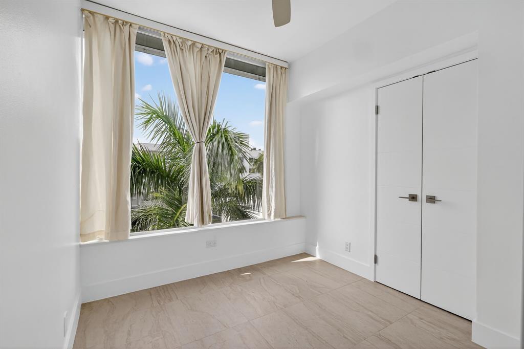 44 Cocoanut Row, Unit 507A Palm Beach, FL 33480 - Photo 20 of 60 a view of a room with a large window and wooden floor