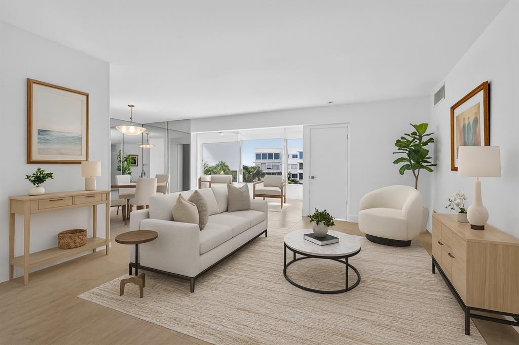 44 Cocoanut Row, Unit 507A Palm Beach, FL 33480 - Photo 2 of 60 a living room with furniture a fireplace and white walls