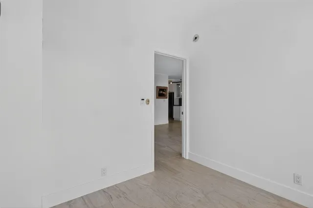 a bathroom with a sink a vanity a shower and a mirror