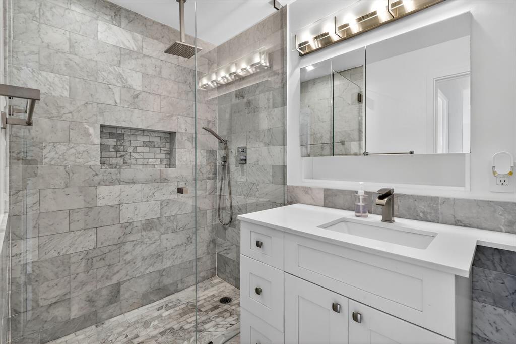 44 Cocoanut Row, Unit 507A Palm Beach, FL 33480 - Photo 25 of 60 a bathroom with a sink a vanity a shower and a mirror