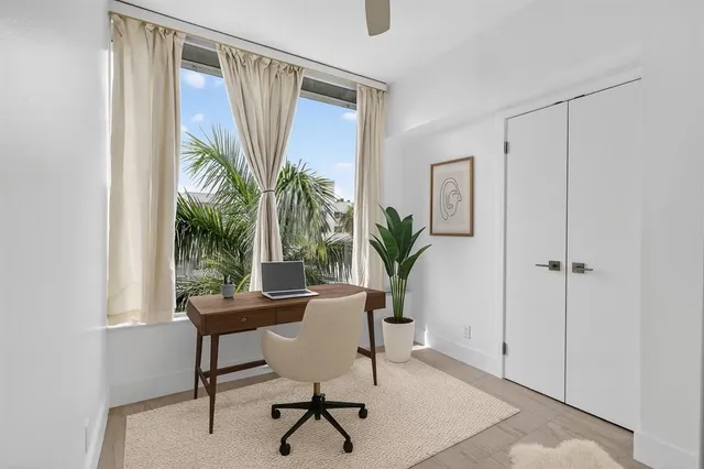 a workspace with furniture and a window