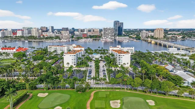 an aerial view of a city with lake view