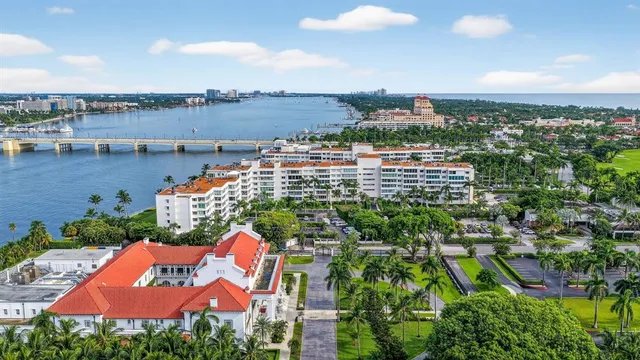 an aerial view of a house with a garden and outdoor seating