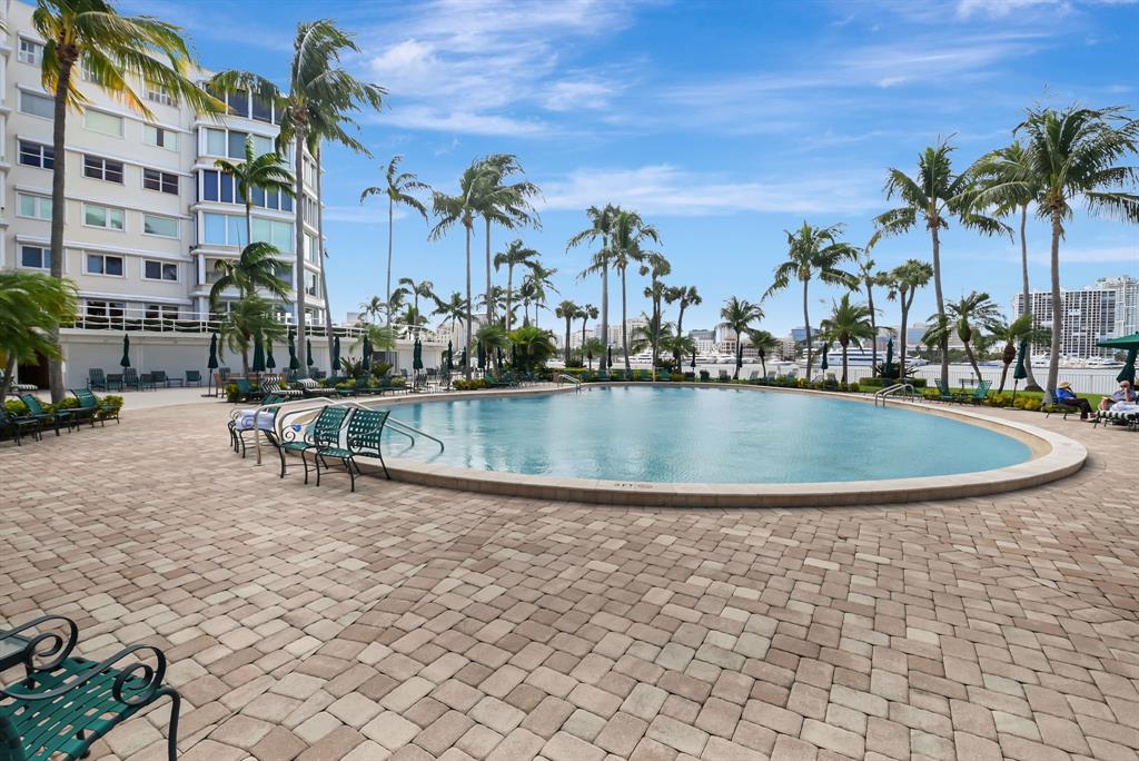 44 Cocoanut Row, Unit 507A Palm Beach, FL 33480 - Photo 45 of 60 a view of a swimming pool with outdoor seating