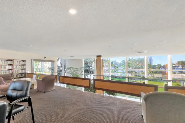 a view of a street with cars parked