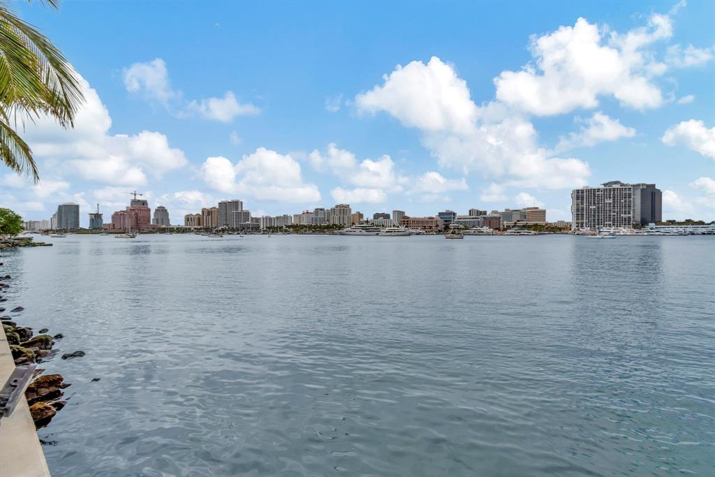 44 Cocoanut Row, Unit 507A Palm Beach, FL 33480 - Photo 53 of 60 a view of a lake with houses in the back