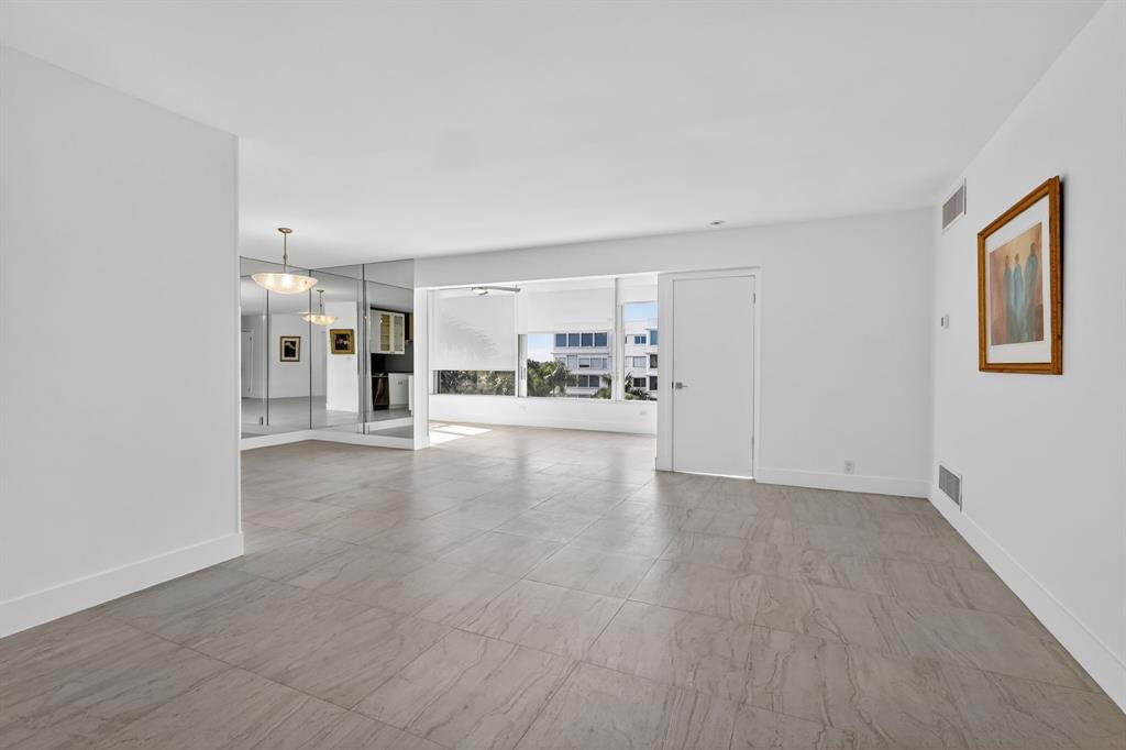44 Cocoanut Row, Unit 507A Palm Beach, FL 33480 - Photo 8 of 60 a view of a kitchen with a sink and a refrigerator