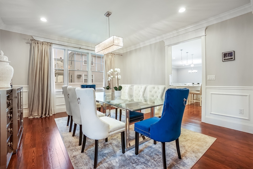 57 Walnut Street Newton, MA 02460 - Photo 15 of 39 a view of a dining room with furniture wooden floor and chandelier