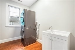 57 Walnut Street Newton, MA 02460 - Photo 24 of 39 a bathroom with a sink and a mirror
