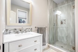 57 Walnut Street Newton, MA 02460 - Photo 31 of 39 a bathroom with a sink and a mirror