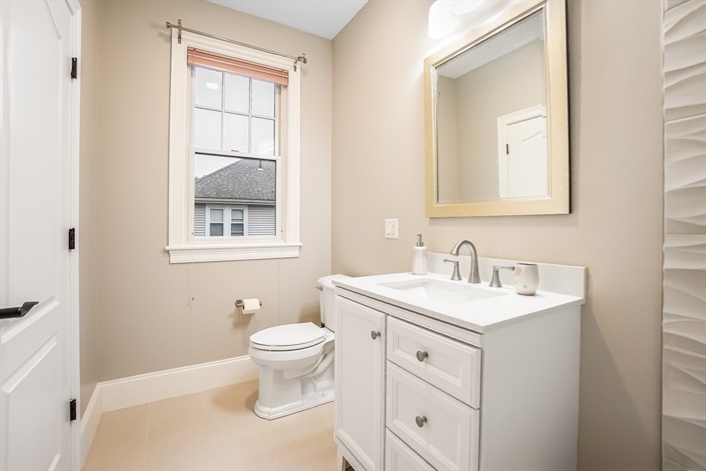 57 Walnut Street Newton, MA 02460 - Photo 33 of 39 a bathroom with a toilet sink and mirror