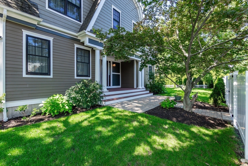 57 Walnut Street Newton, MA 02460 - Photo 5 of 39 a view of a backyard with plants and large trees
