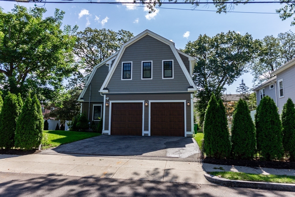 57 Walnut Street Newton, MA 02460 - Photo 8 of 39 a front view of a house with garden