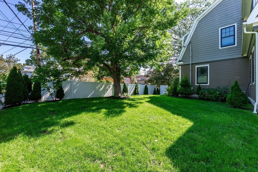 57 Walnut Street Newton, MA 02460 - Photo 9 of 39 a view of house with a yard